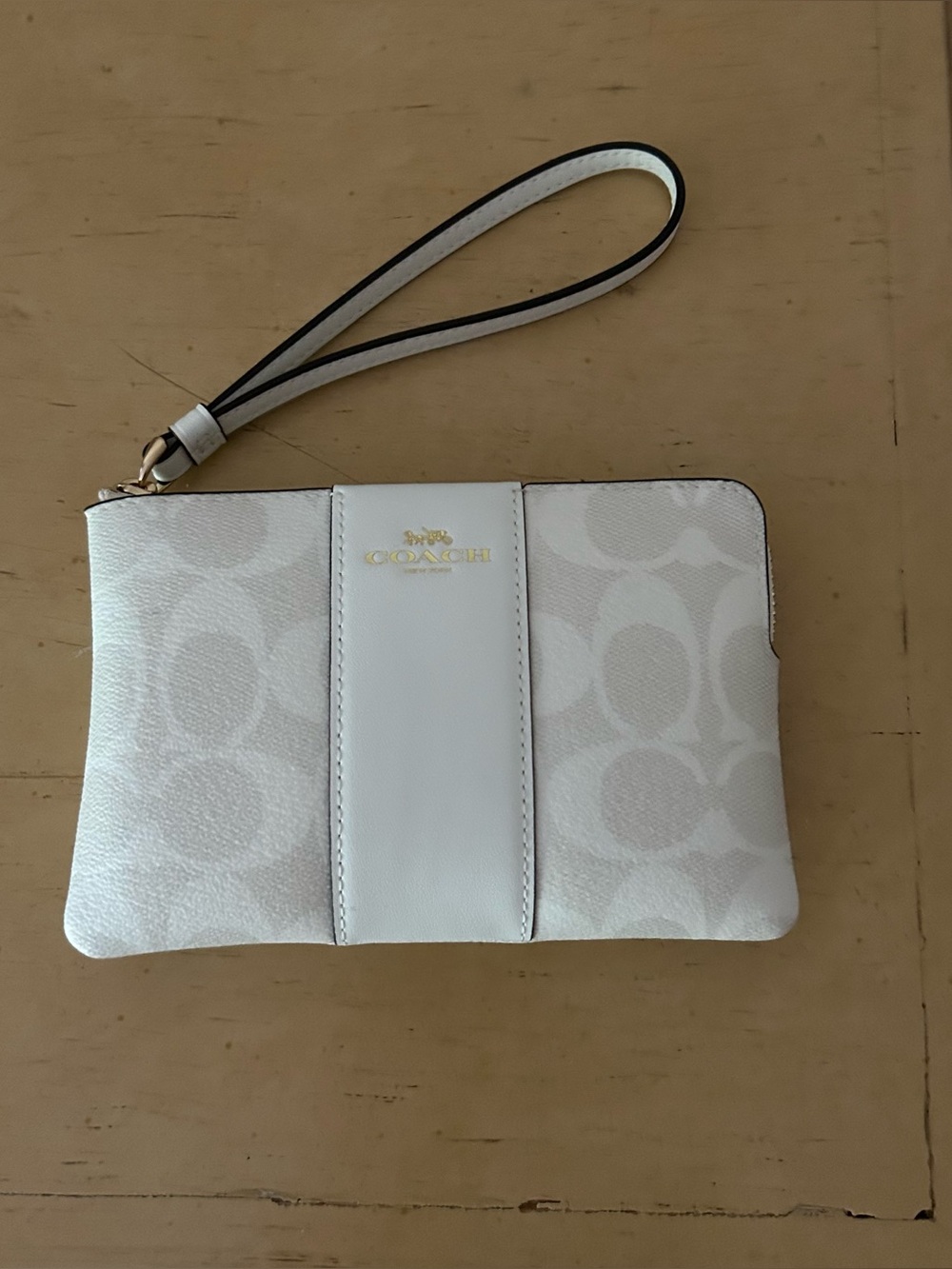 Coach corner zip wristlet in signature canvas with center stripe in white cw 854